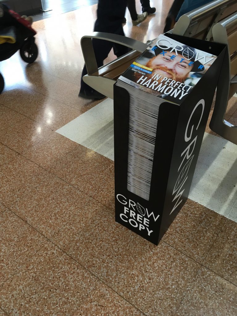 grab a Grow Magazines from a black custom bulk bin